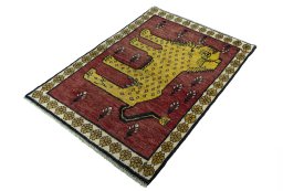 Corner detail of 2000s Persian Gabbeh rug showing border pattern and Wool pile