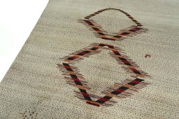 Backside of handmade New Persian Gabbeh rug showing knot structure and weave density