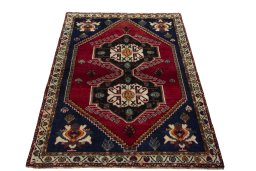 Surface texture of 2000s Persian Gabbeh rug with natural Wool and intricate pattern