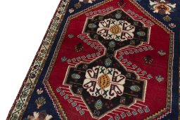 Backside of handmade 2000s Persian Gabbeh rug showing knot structure and weave density