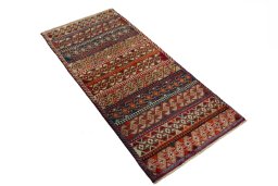 Close-up detail of 2000s Persian Gabbeh rug from Iran / Persia showing Wool weave
