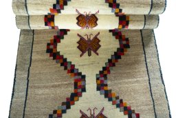 Full view of 2000s Persian Gabbeh rug from Iran / Persia, 209 × 82 cm in Beige tones