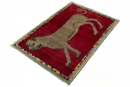 Corner detail of 2000s Persian Gabbeh rug showing border pattern and Wool pile