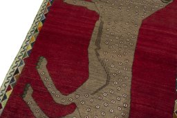 Backside of handmade 2000s Persian Gabbeh rug showing knot structure and weave density