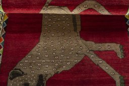 Full view of 2000s Persian Gabbeh rug from Iran / Persia, 162 × 109 cm in Red tones