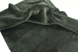 Corner detail of New Persian Gabbeh rug showing border pattern and Wool pile