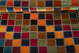 Full view of 2000s Persian Gabbeh rug from Iran / Persia, 210 × 131 cm in Multi Color tones