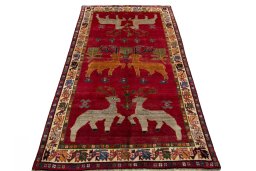 Surface texture of 2000s Persian Gabbeh rug with natural Wool and intricate pattern