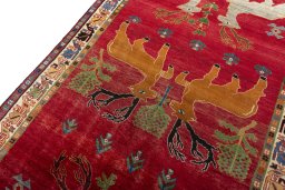 Backside of handmade 2000s Persian Gabbeh rug showing knot structure and weave density