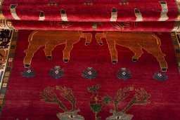 Full view of 2000s Persian Gabbeh rug from Iran / Persia, 283 × 153 cm in Red tones