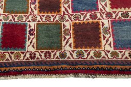 Central medallion detail of 2000s Persian Gabbeh rug from Iran / Persia