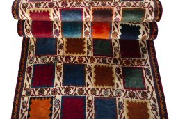 Full view of 2000s Persian Gabbeh rug from Iran / Persia, 243 × 81 cm in Multi Color tones