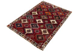 Corner detail of 2000s Persian Gabbeh rug showing border pattern and Wool pile