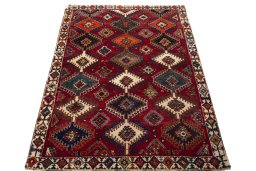 Surface texture of 2000s Persian Gabbeh rug with natural Wool and intricate pattern