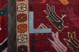 Corner detail of 2000s Persian Gabbeh rug showing border pattern and Wool pile