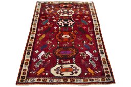 Surface texture of 2000s Persian Gabbeh rug with natural Wool and intricate pattern