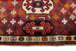 Backside of handmade 2000s Persian Gabbeh rug showing knot structure and weave density