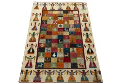 Surface texture of 2000s Persian Gabbeh rug with natural Wool and intricate pattern