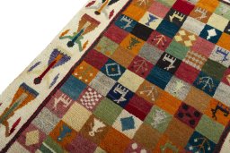 Backside of handmade 2000s Persian Gabbeh rug showing knot structure and weave density