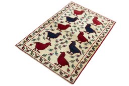 Corner detail of 2000s Persian Gabbeh rug showing border pattern and Wool pile