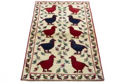 Surface texture of 2000s Persian Gabbeh rug with natural Wool and intricate pattern