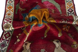 Corner detail of 2000s Persian Gabbeh rug showing border pattern and Wool pile