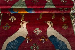 Full view of 2000s Persian Gabbeh rug from Iran / Persia, 227 × 140 cm in Red tones