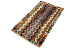 Corner detail of 2000s Persian Gabbeh rug showing border pattern and Wool pile
