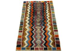 Surface texture of 2000s Persian Gabbeh rug with natural Wool and intricate pattern