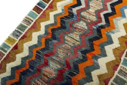 Backside of handmade 2000s Persian Gabbeh rug showing knot structure and weave density