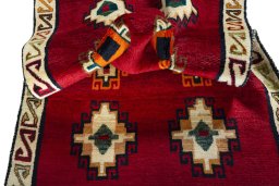 Corner detail of 2000s Persian Gabbeh rug showing border pattern and Wool pile