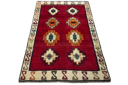 Surface texture of 2000s Persian Gabbeh rug with natural Wool and intricate pattern