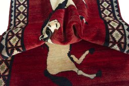 Corner detail of 2000s Persian Gabbeh rug showing border pattern and Wool pile