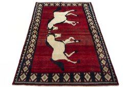 Surface texture of 2000s Persian Gabbeh rug with natural Wool and intricate pattern