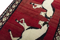 Backside of handmade 2000s Persian Gabbeh rug showing knot structure and weave density