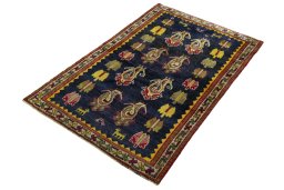 Corner detail of 2000s Persian Gabbeh rug showing border pattern and Wool pile