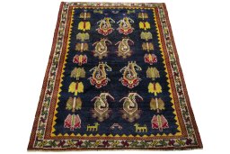 Surface texture of 2000s Persian Gabbeh rug with natural Wool and intricate pattern