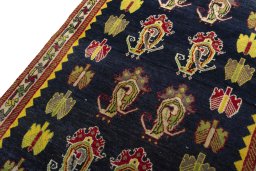 Backside of handmade 2000s Persian Gabbeh rug showing knot structure and weave density