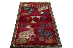 Surface texture of 2000s Persian Gabbeh rug with natural Wool and intricate pattern