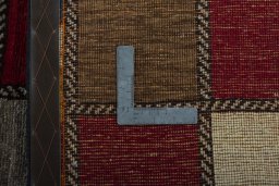 Close-up detail of 2000s Persian Gabbeh rug from Iran / Persia showing Wool weave