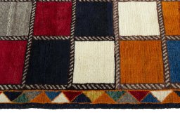 Close-up detail of 2000s Persian Gabbeh rug from Iran / Persia showing Wool weave