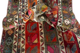 Corner detail of 2000s Persian Gabbeh rug showing border pattern and Wool pile