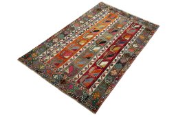 Corner detail of 2000s Persian Gabbeh rug showing border pattern and Wool pile