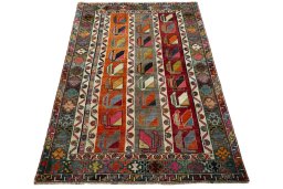 Surface texture of 2000s Persian Gabbeh rug with natural Wool and intricate pattern
