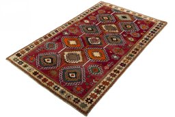 Corner detail of 2000s Persian Gabbeh rug showing border pattern and Wool pile