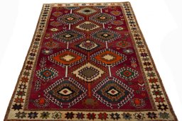 Surface texture of 2000s Persian Gabbeh rug with natural Wool and intricate pattern