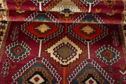 Full view of 2000s Persian Gabbeh rug from Iran / Persia, 224 × 136 cm in Red tones