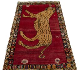 Surface texture of 2000s Persian Gabbeh rug with natural Wool and intricate pattern
