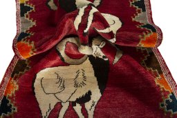 Corner detail of 2000s Persian Gabbeh rug showing border pattern and Wool pile