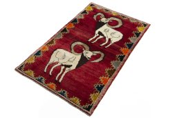 Corner detail of 2000s Persian Gabbeh rug showing border pattern and Wool pile